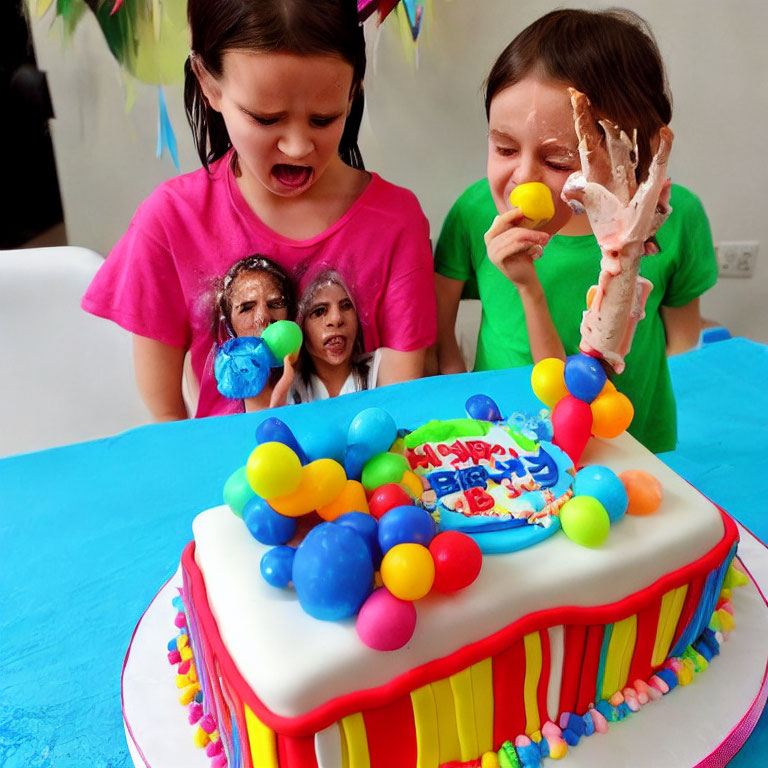 Children laughing with cake smash at colorful birthday party