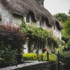 Tranquil water body with flower-covered cottage and wooden chair