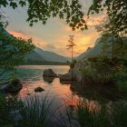 Tranquil riverside sunset scene with wooden boats and lush greenery