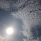 Giant winged creature carrying passengers in stormy skies