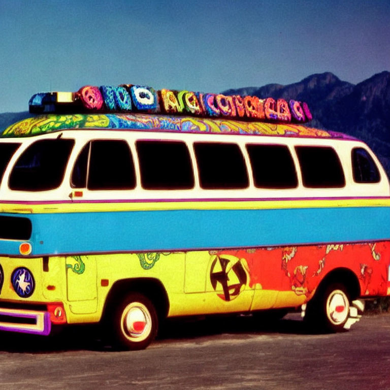 Vintage bus with psychedelic patterns and peace sign, rooftop adorned with woven blanket, set against mountain backdrop