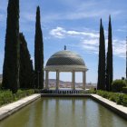 Colorful garden painting with pavilion, cypress trees, and blue sky