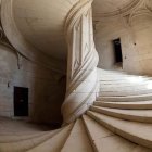 Luxurious space with ornate spiral staircase and gold details