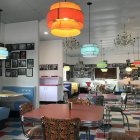 Vintage Diner Interior with Blue & White Walls, Checkered Floor, Red Booth Seats & Juke