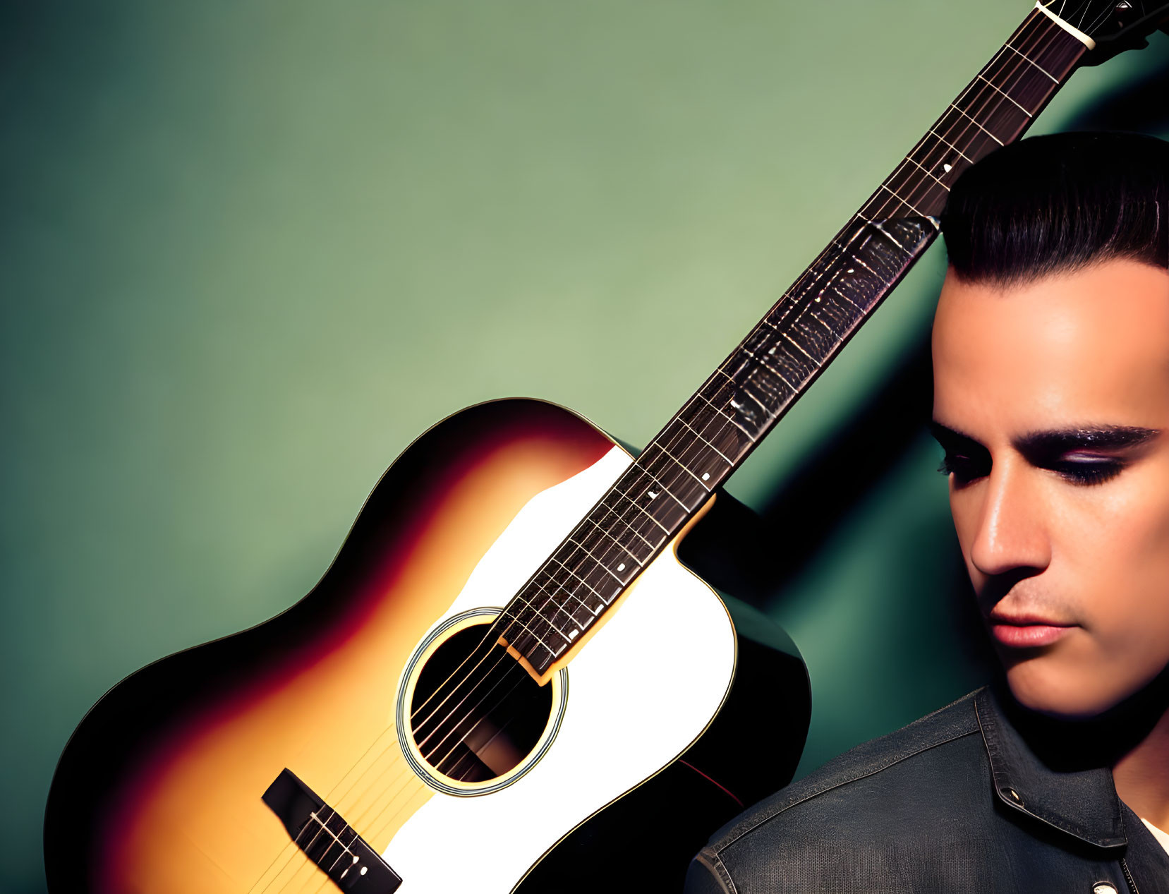 Man with Pompadour Beside Acoustic Guitar on Teal Gradient Background