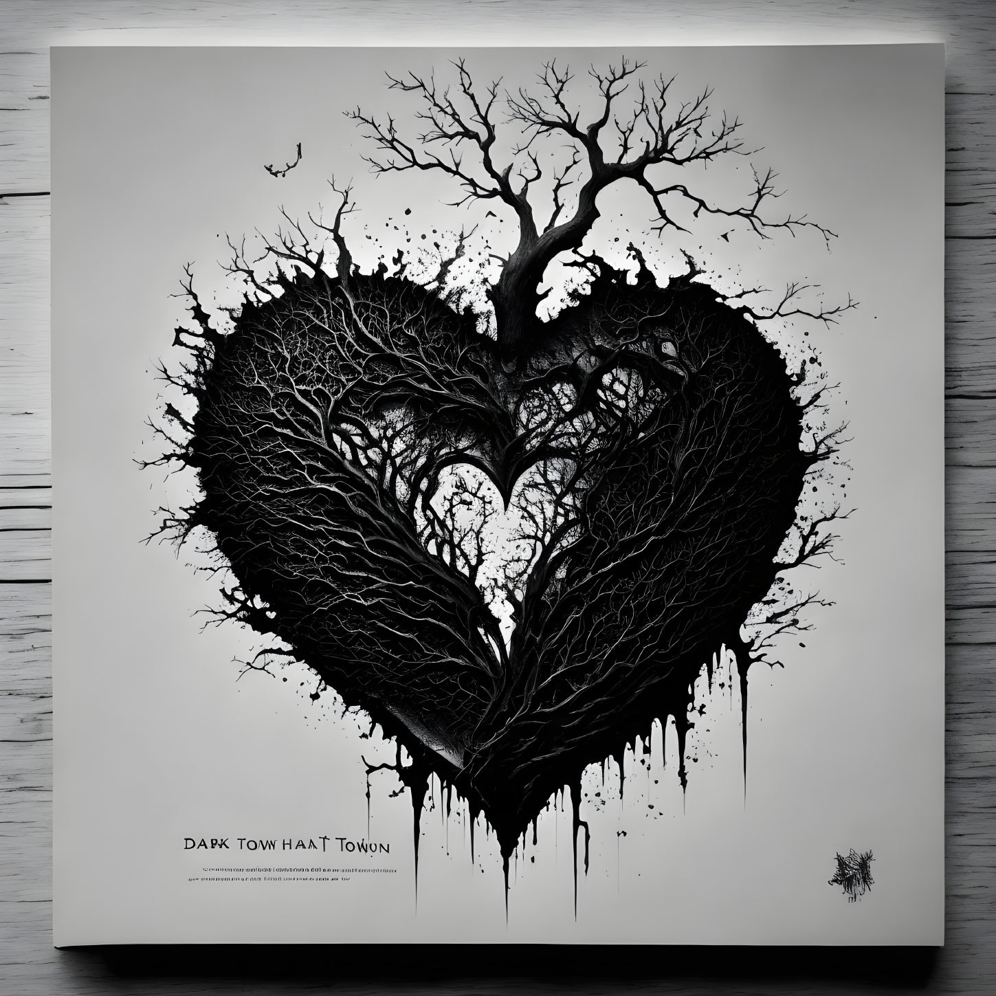 Monochrome heart-shaped tree branches with paint drips on textured background