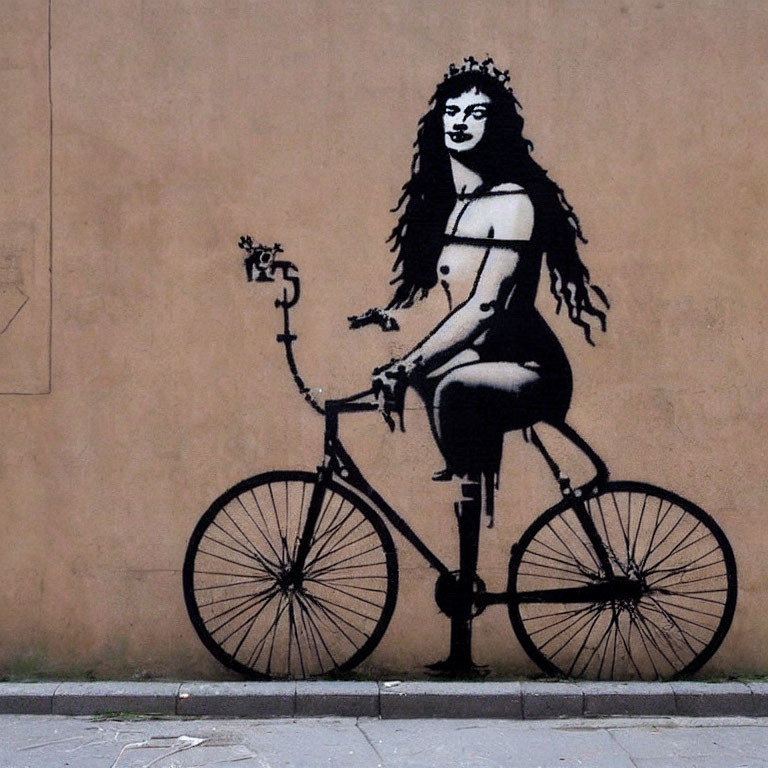 Stencil graffiti of woman with crown riding bicycle on beige wall