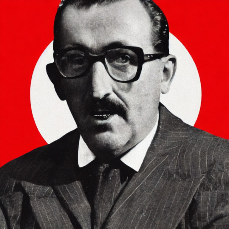 Monochrome image of man in glasses on red and white backdrop