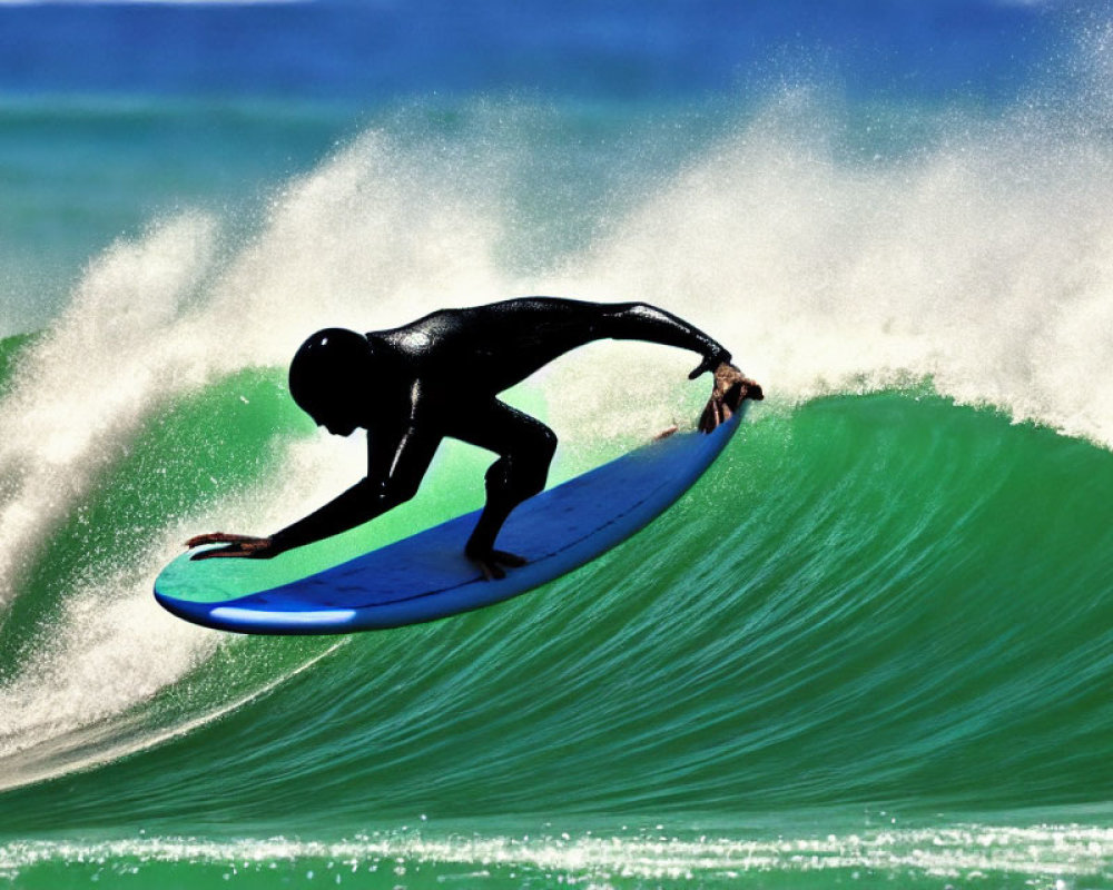 Surfer in Black Wetsuit Riding Blue Surfboard on Green Wave