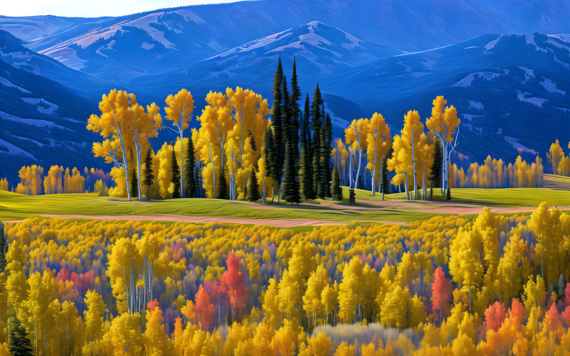 Scenic autumn landscape with golden-yellow and fiery orange trees and distant mountains