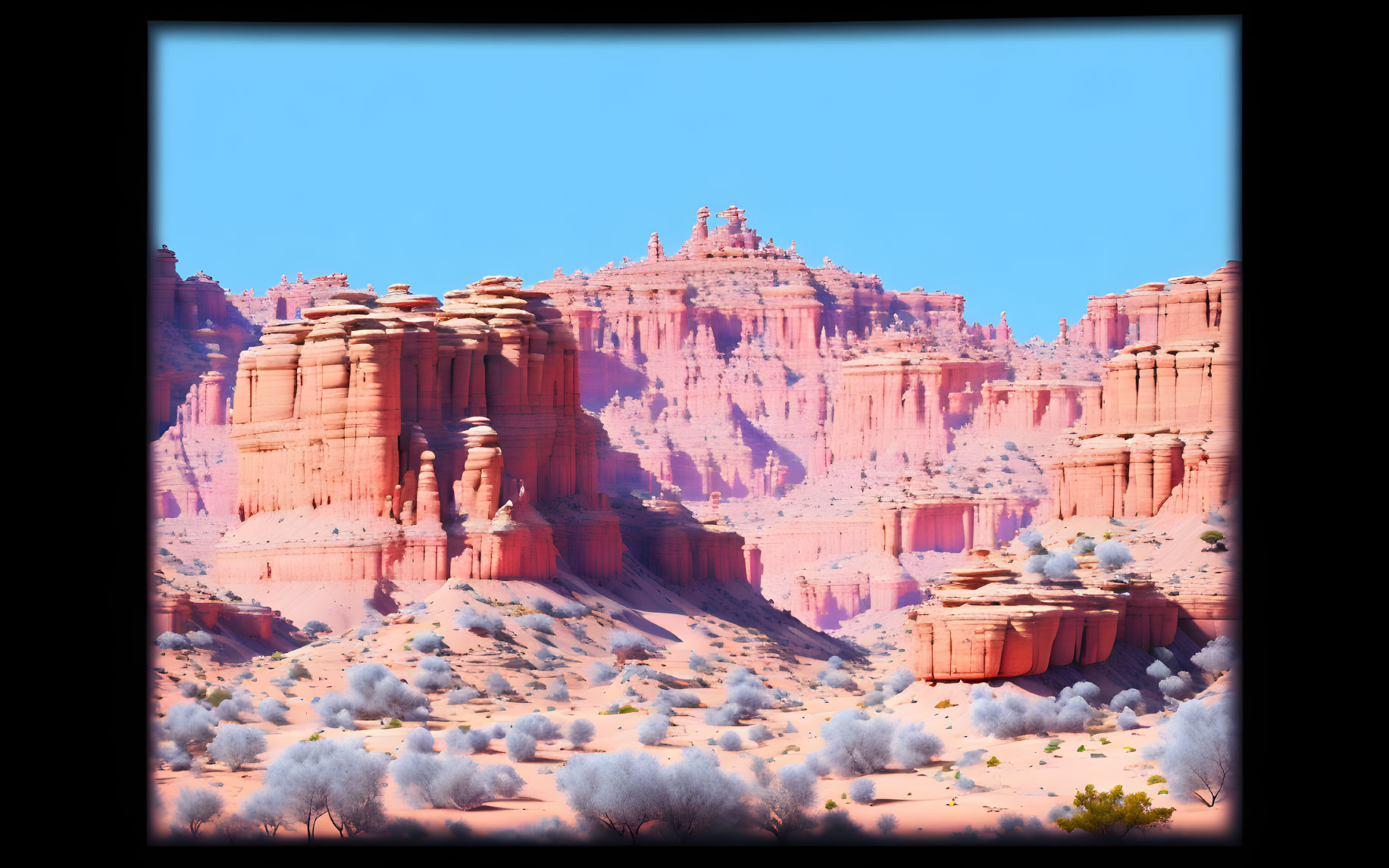 Vibrant red sandstone towers under blue sky in desert landscape