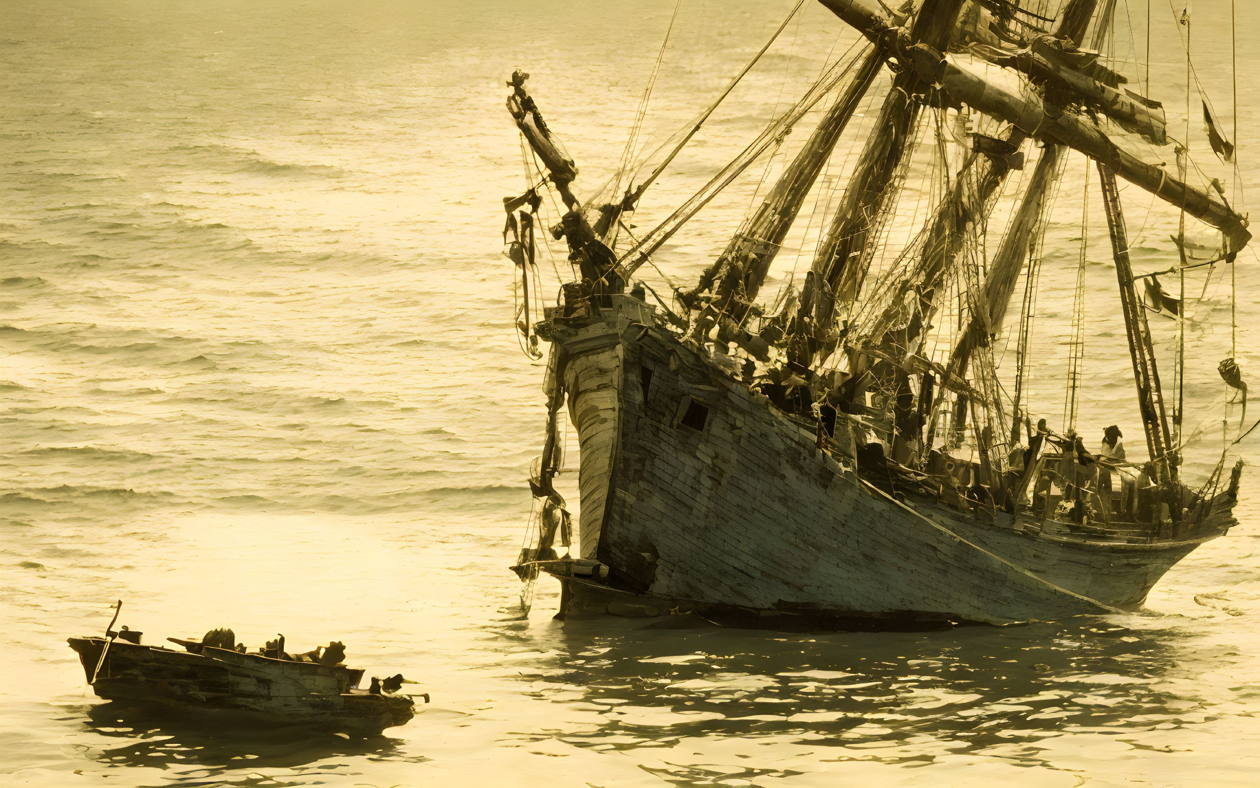 Vintage sailing ship with crew and rowboat in golden light on calm sea