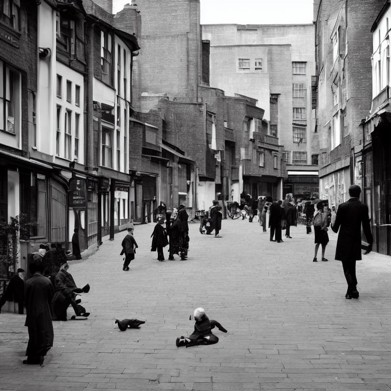 Monochrome photo of busy street with people, child, and dog playing