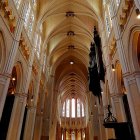 Gothic Cathedral Interior with Vaulted Ceiling and Stained Glass Windows