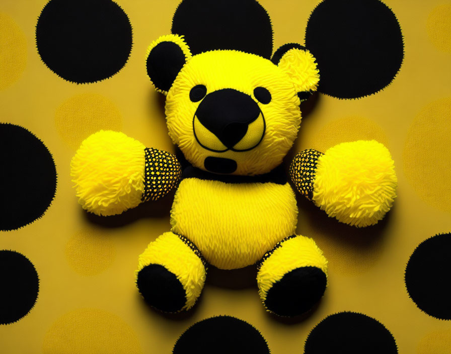 Yellow Plush Bear with Black Accents on Dotted Background