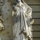 Woman in Blue and Gold Robe in Ornate Room