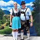 Traditional German Attire Couple in Quaint Village Setting