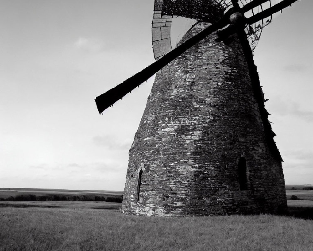 Monochrome picture of solitary windmill in open landscape