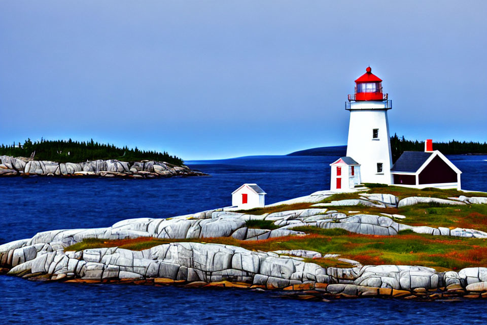 Scenic white lighthouse on rocky coastline with red top and small buildings under cloudy sky