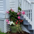 Colorful Flower-Adorned Staircase Painting on Blue Background