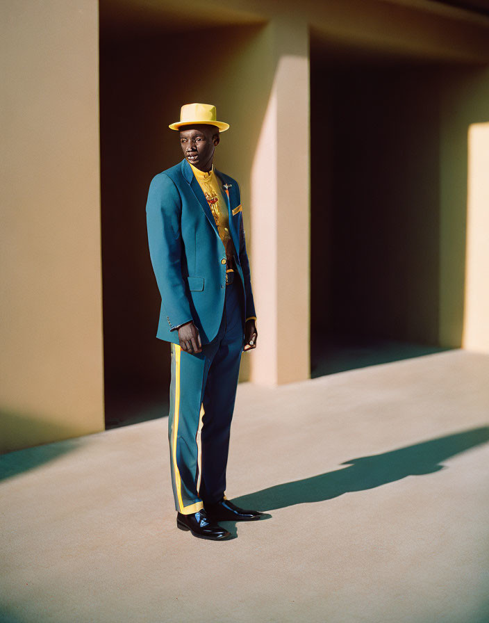 Man in Bright Blue Suit with Yellow Accents and Wide-brimmed Hat