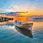 Tranquil sunset harbor scene with rowboat, calm water, ships, and buildings