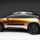 Golden beetle-inspired car with wings and circular windows on gradient backdrop