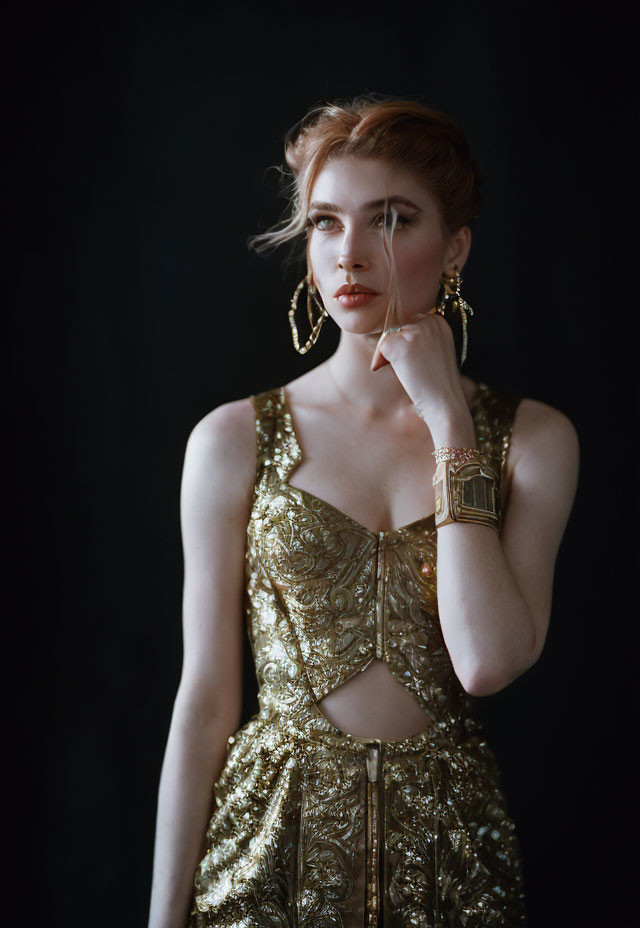 Elegant woman in gold sequined dress with styled hair and accessories against dark background