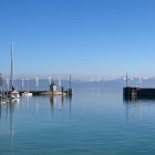 Fantastical landscape with floating structures and serene blue water