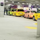 Snowy Taxi Stand Watercolor Painting with Yellow Taxis and People