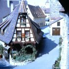 Snowy Village Street with Christmas Decorated Half-Timbered Houses