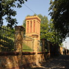 Mystical Figure and Clock Tower in Twilight Scene