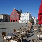 Vibrant European village puzzle with colorful buildings and calm pond