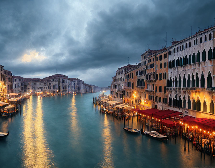 Grand Canal in Venice at Twilight with Illuminated Buildings and Moody Clouds