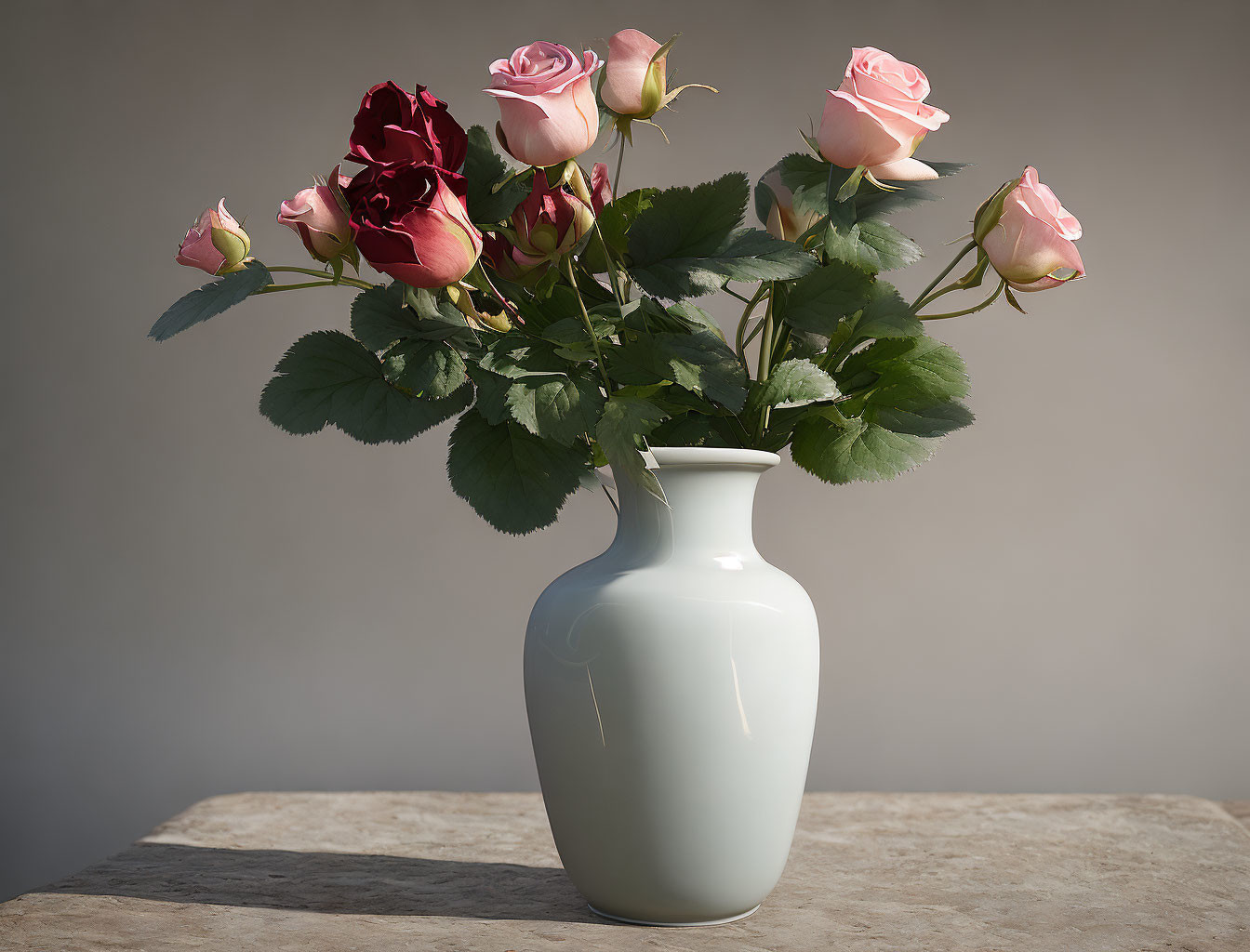 Pink and Red Roses Bouquet in White Vase on Tabletop