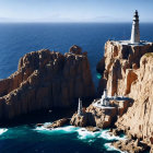 Scenic lighthouse on rugged cliffs overlooking ocean and sky