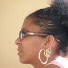Woman Profile with Glitter Hair & Elegant Earrings on Golden Background