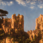 Ancient sandstone structures under a blue sky with clouds and rugged texture.