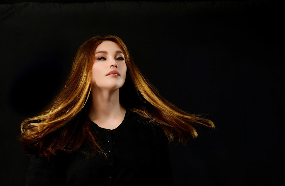 Auburn-Haired Woman Gazing in Warm Light