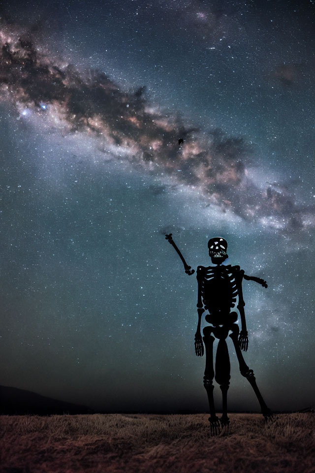 Skeleton under starry night sky with Milky Way - surreal and spooky atmosphere