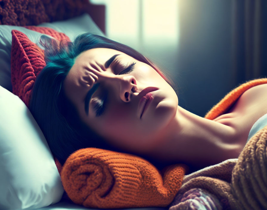 Woman peacefully resting in bed bathed in warm light