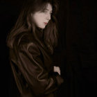 Person with Voluminous Dreadlocks in Leather Jacket Against Cosmic Background