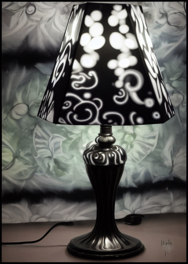 Ornate table lamp with patterned shade illuminating swirly fabric wall