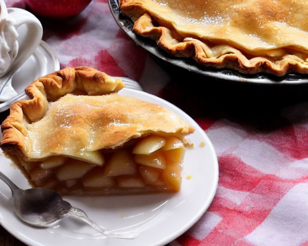 Golden-crusted apple pie with juicy filling on plate.