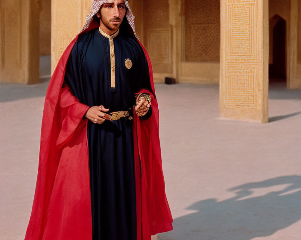 Traditional Arab man in red cloak with cane in sandstone arcade