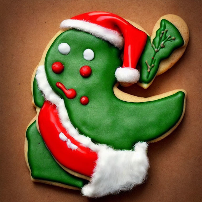 Festive Green Dinosaur Cookie with Santa Hat and Icing Details