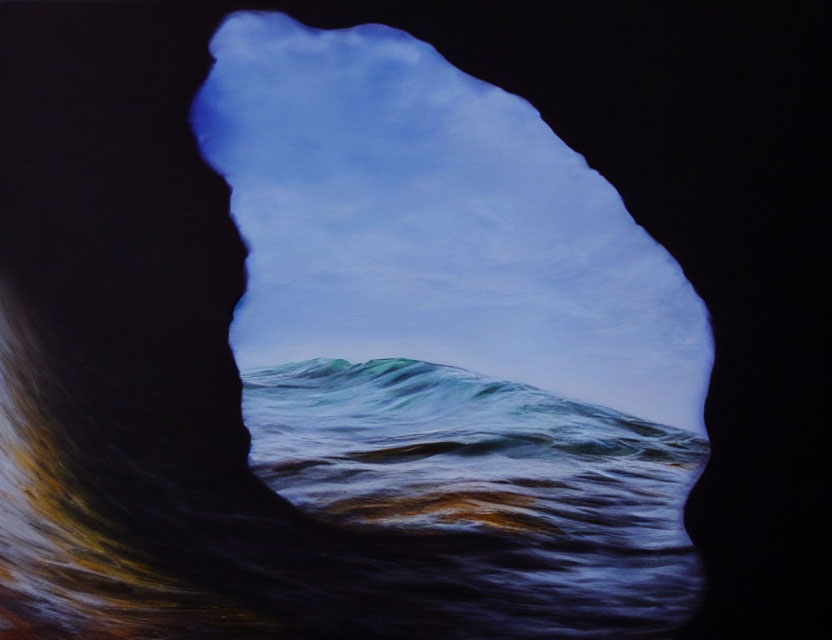 Ocean and Sky View from Dark Cave with Cresting Wave