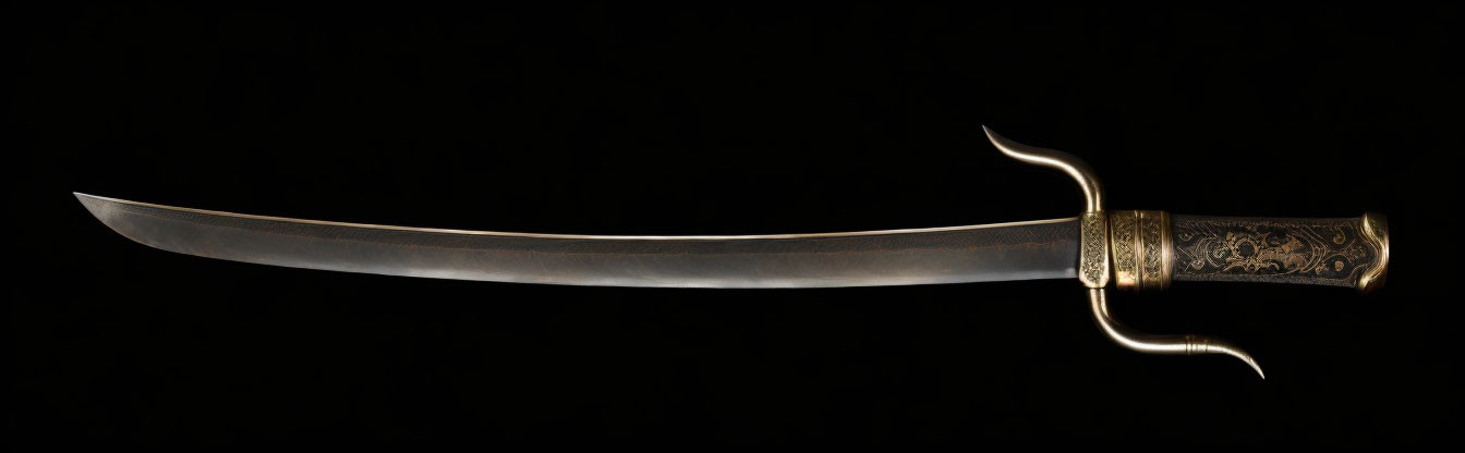 Intricately engraved antique curved sword on black background