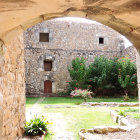 Rustic house with stone pathway in watercolor art