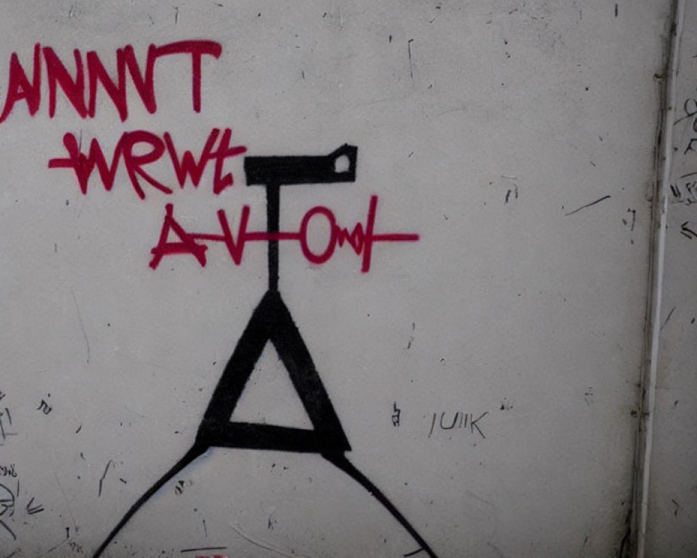 Monochrome graffiti of stylized tripod symbol with red 'Camera' crossed out